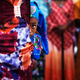 A girl from the African Hebrew Israelite community hides behind an adult during the Jewish holiday of Shavuot in the southern Israeli town of Dimona, on June 15, 2014.